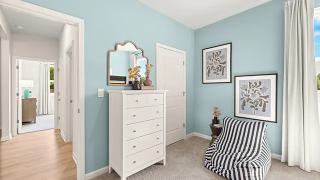 a bedroom with a bed and a dresser in it