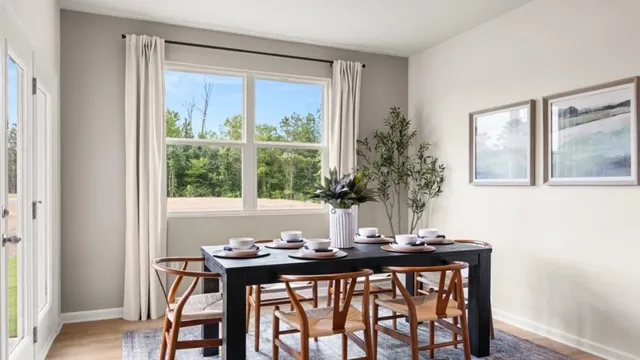 a view of a dining room with furniture and window