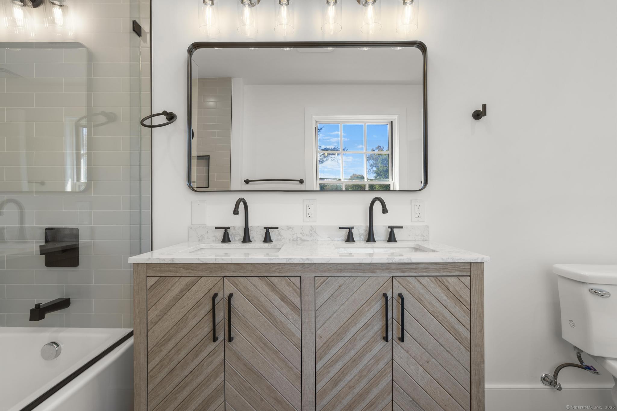 18 Sound Beach Avenue Greenwich, CT 06870 - Photo 15 of 36 a bathroom with a sink vanity and toilet