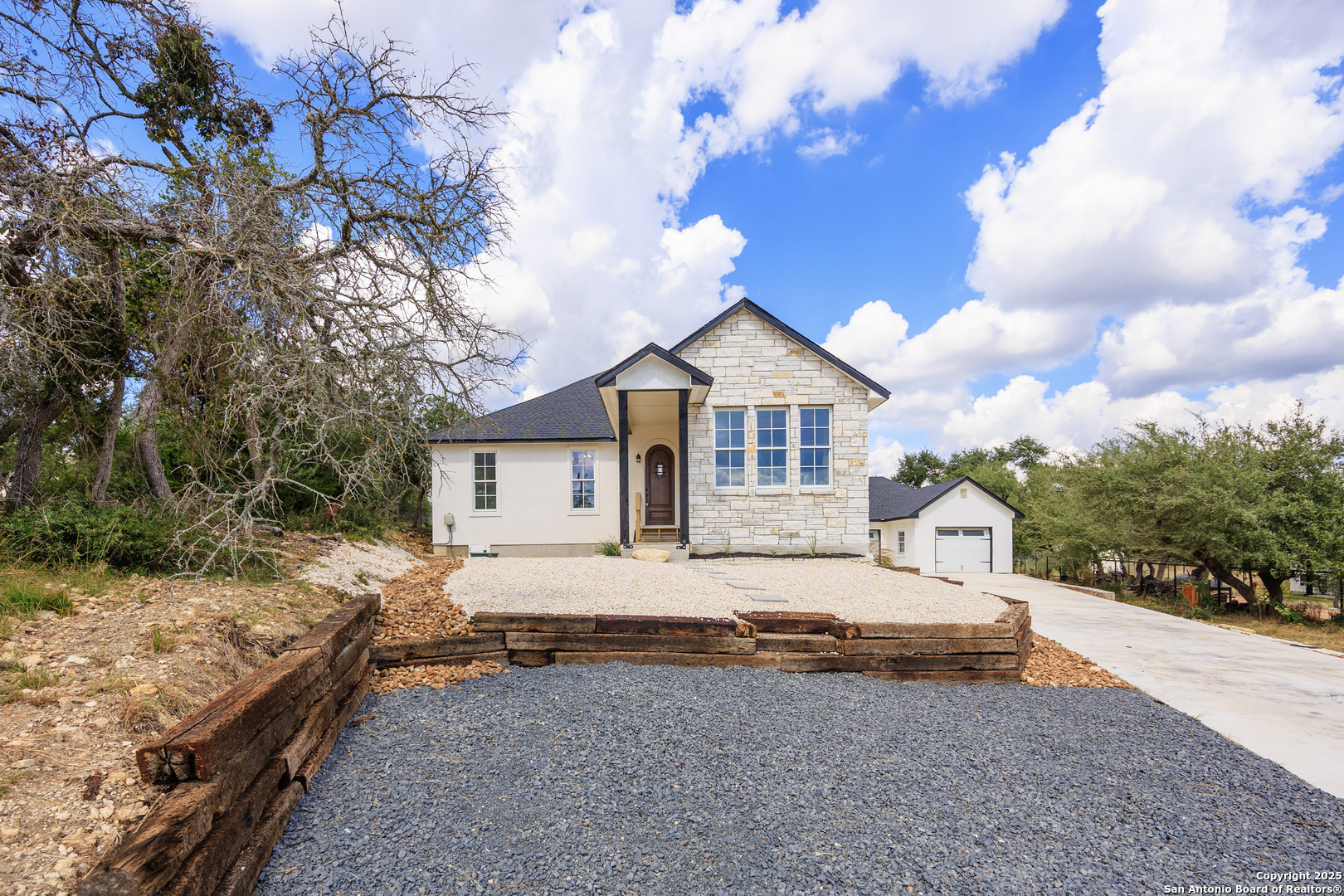 a house that has a tree in front of it