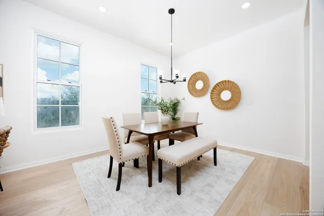 a view of a dining room a table and chairs