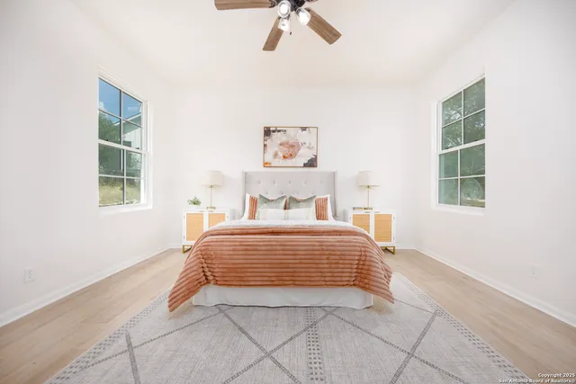 a bedroom with a bed and a window