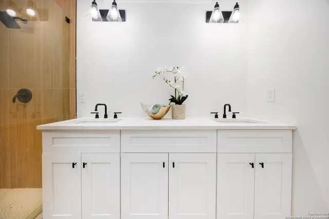 a bathroom with a sink and mirror