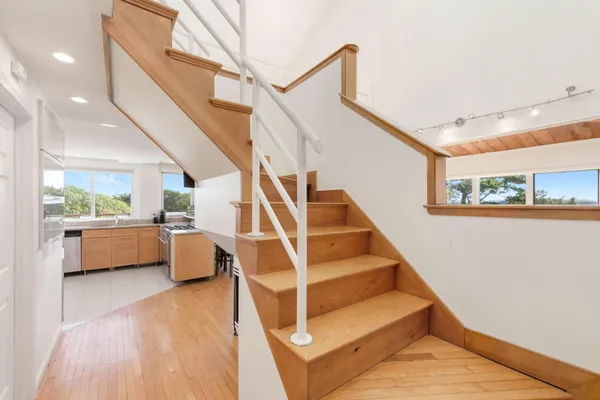 a view of staircase with white walls