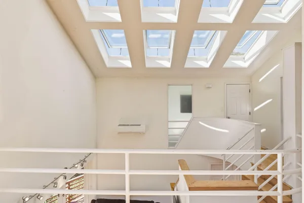 a bedroom with a bed and lamps