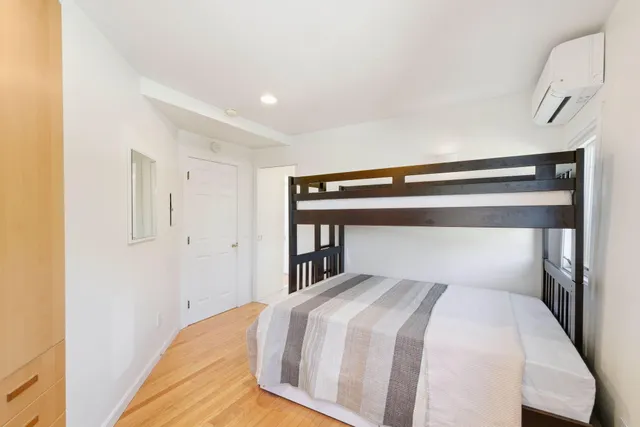 a bedroom with furniture and a window