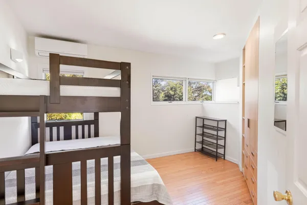 a bathroom with a sink mirror vanity and toilet