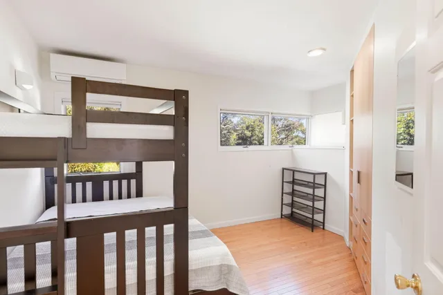 a bathroom with a sink mirror vanity and toilet
