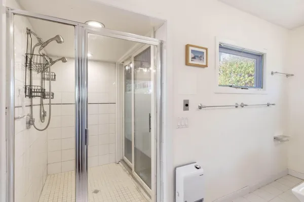 a view of storage and utility room with washer and dryer