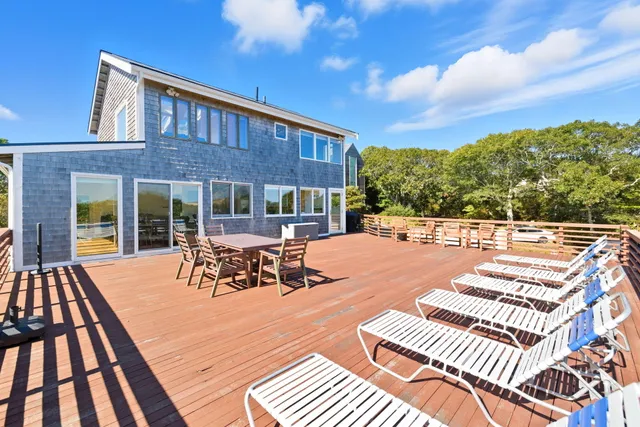 a kitchen with stainless steel appliances kitchen island granite countertop a refrigerator and a stove top oven
