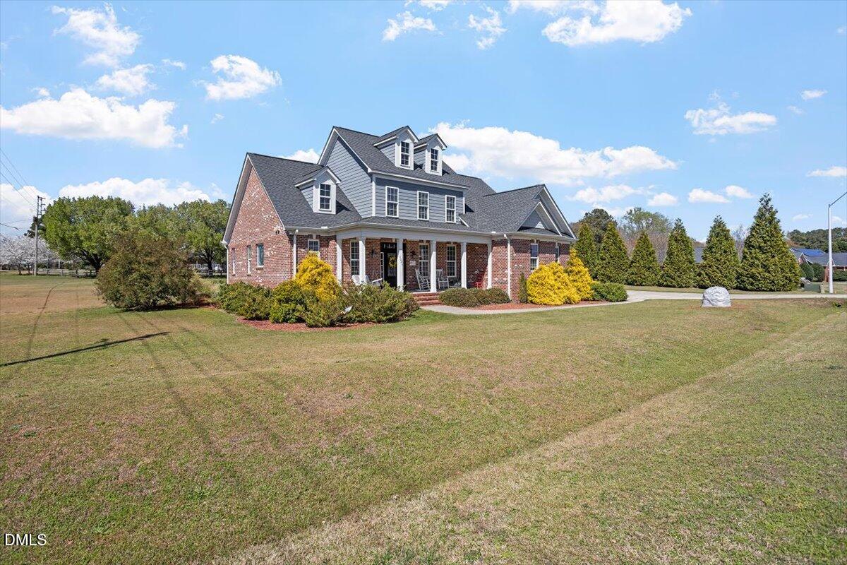 1001 Bellewood Farms Road Raleigh, NC 27603 - Photo 3 of 39 a front view of a house with a yard