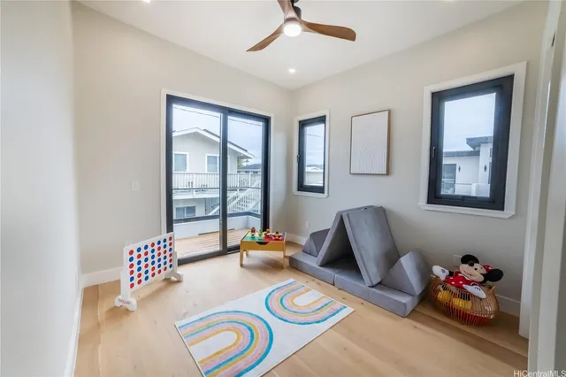 a bedroom with furniture and a large window