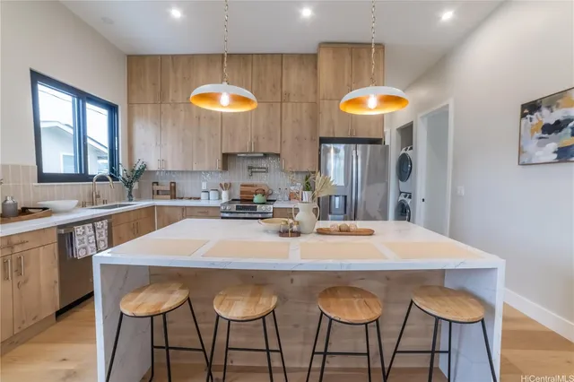a kitchen with furniture and wooden cabinets
