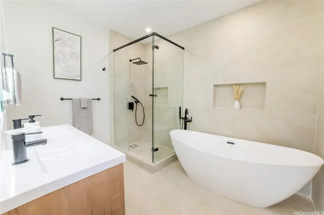 a bathroom with a bathtub and a sink