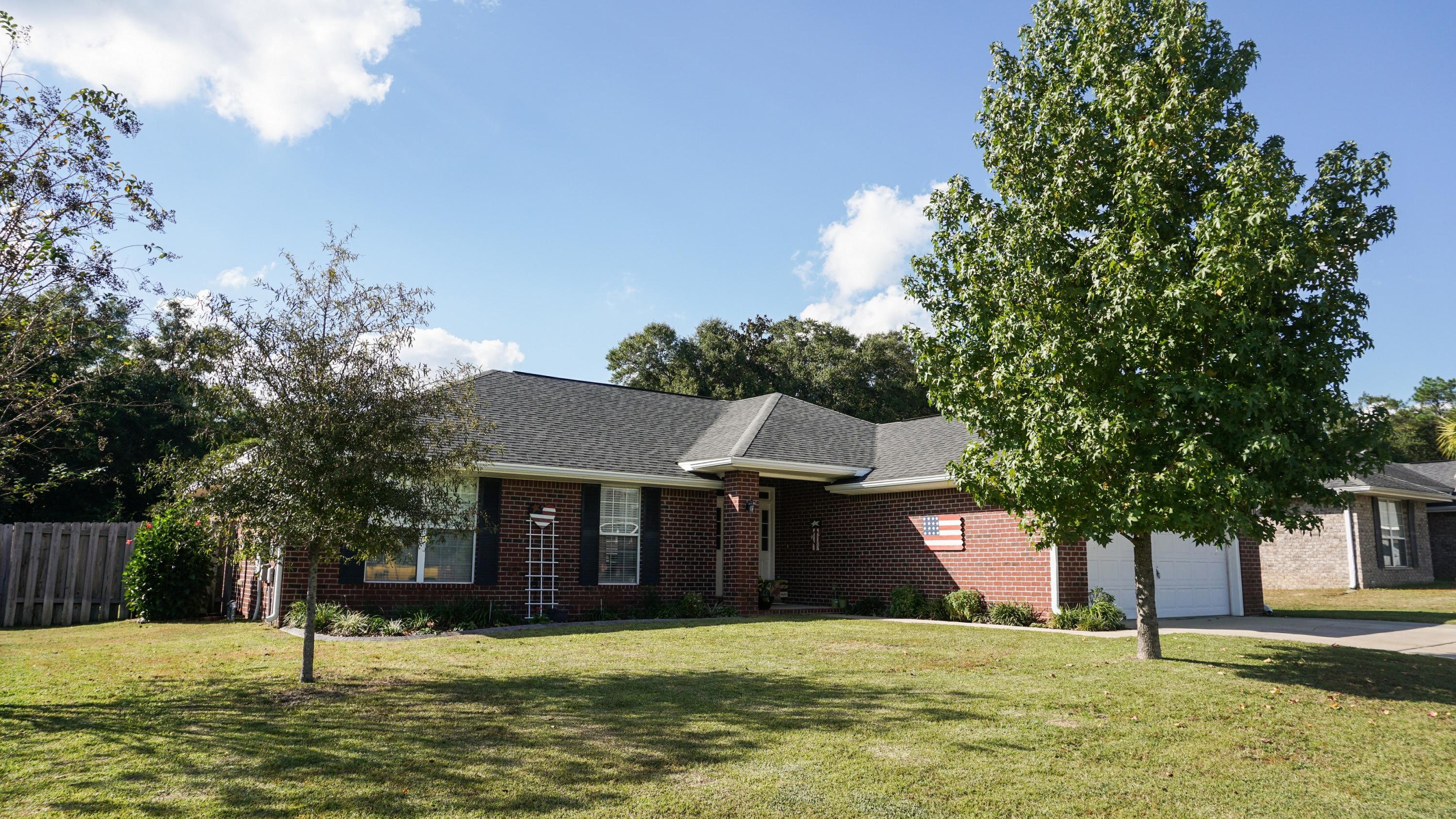 a view of a house with a yard