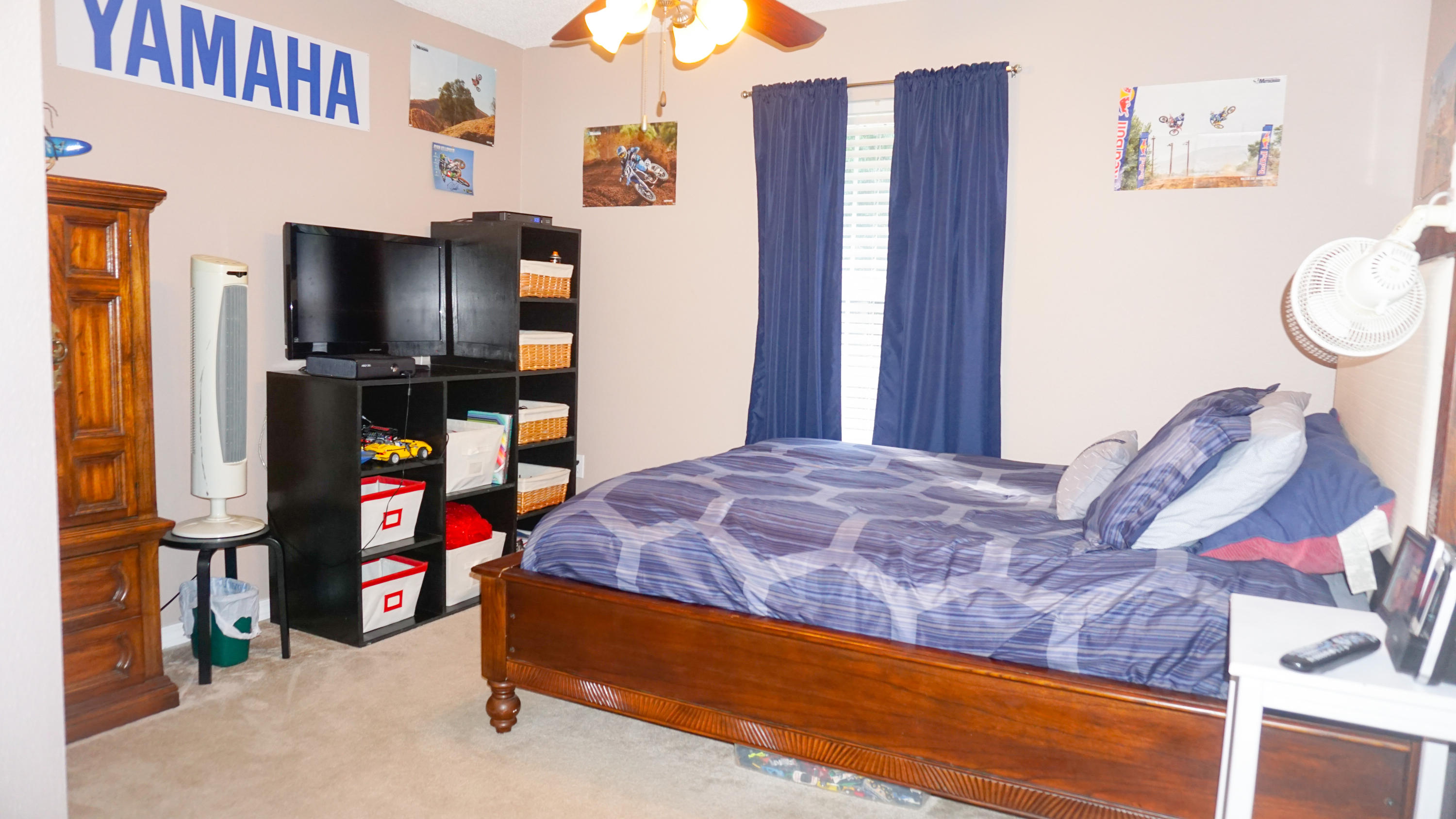 2126 Hagood Loop Crestview, FL 32536 - Photo 13 of 18 a bedroom with a bed and a flat screen tv