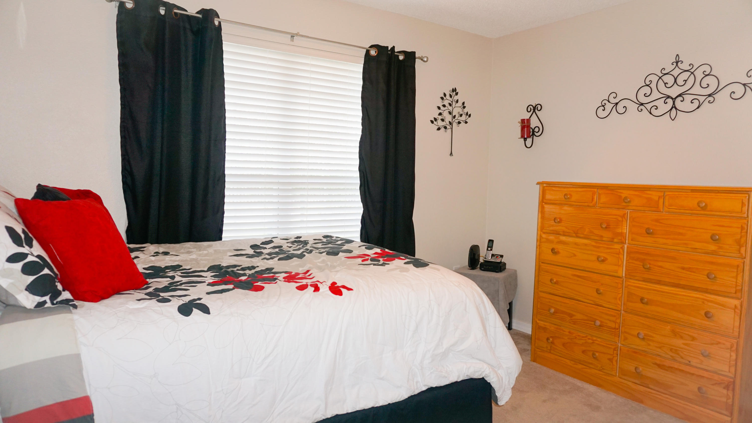 2126 Hagood Loop Crestview, FL 32536 - Photo 14 of 18 a bedroom with a bed and a couch