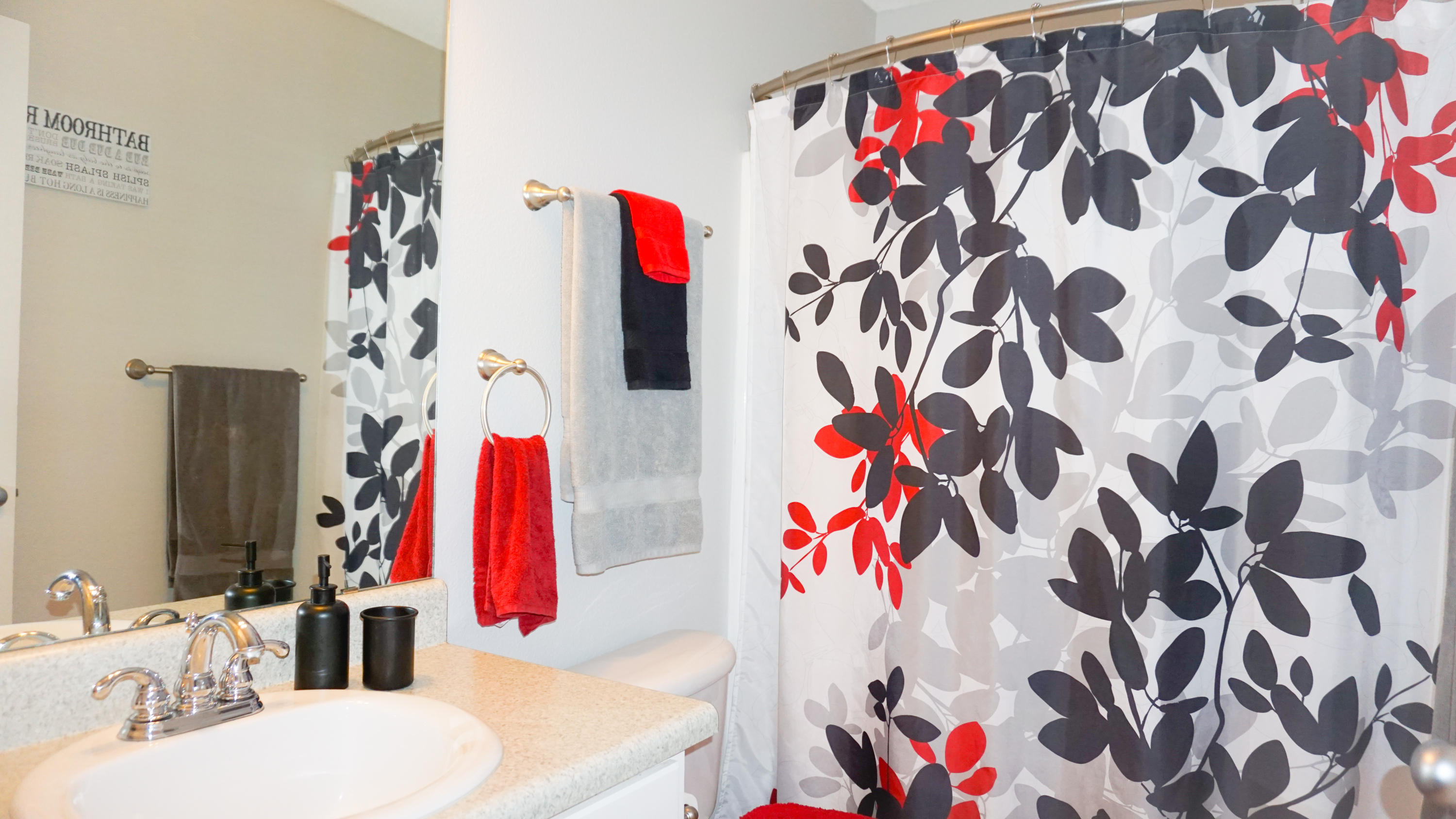 2126 Hagood Loop Crestview, FL 32536 - Photo 15 of 18 a bathroom view with a sink and a curtain