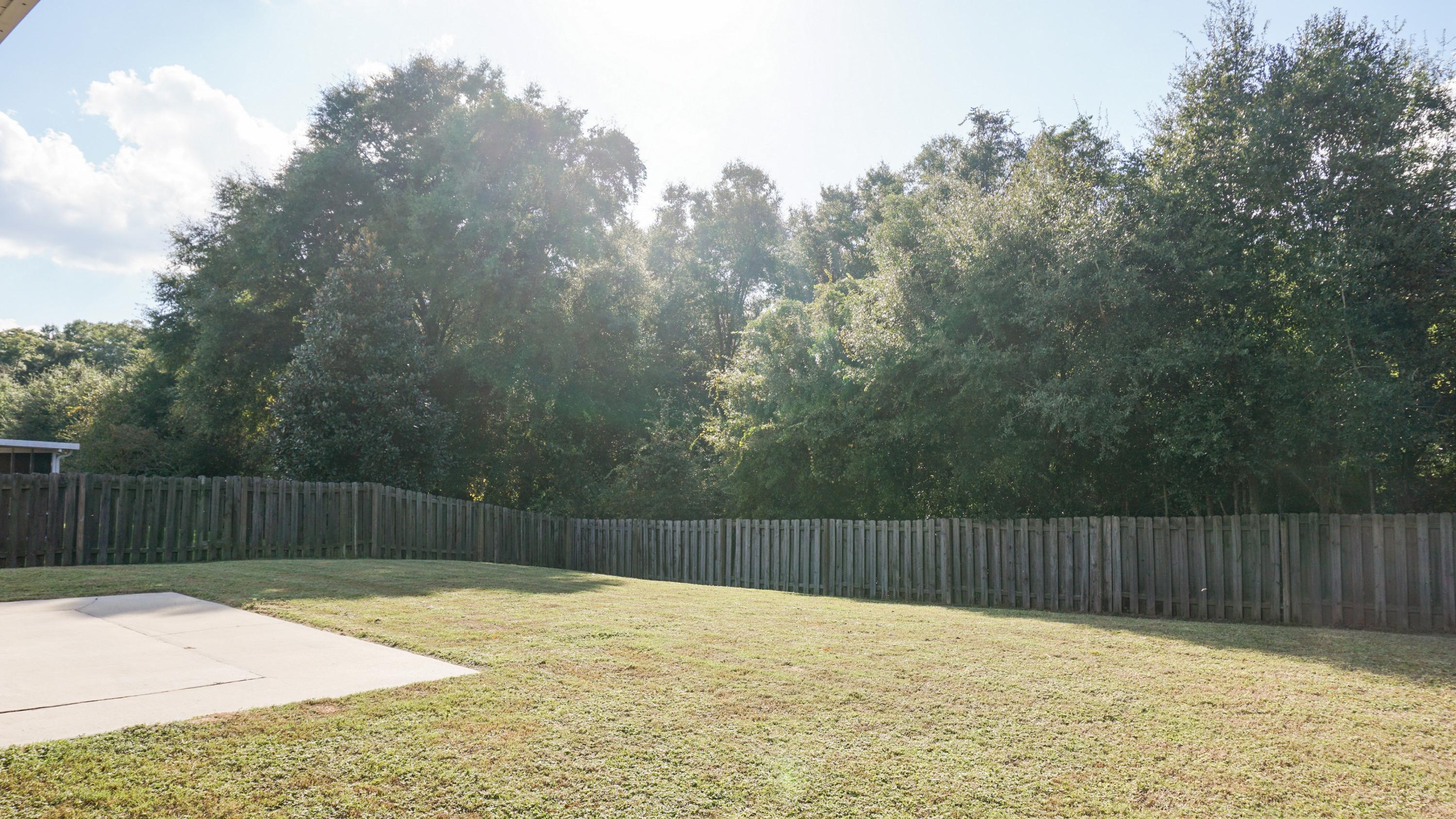 2126 Hagood Loop Crestview, FL 32536 - Photo 18 of 18 a swimming pool with wooden fence
