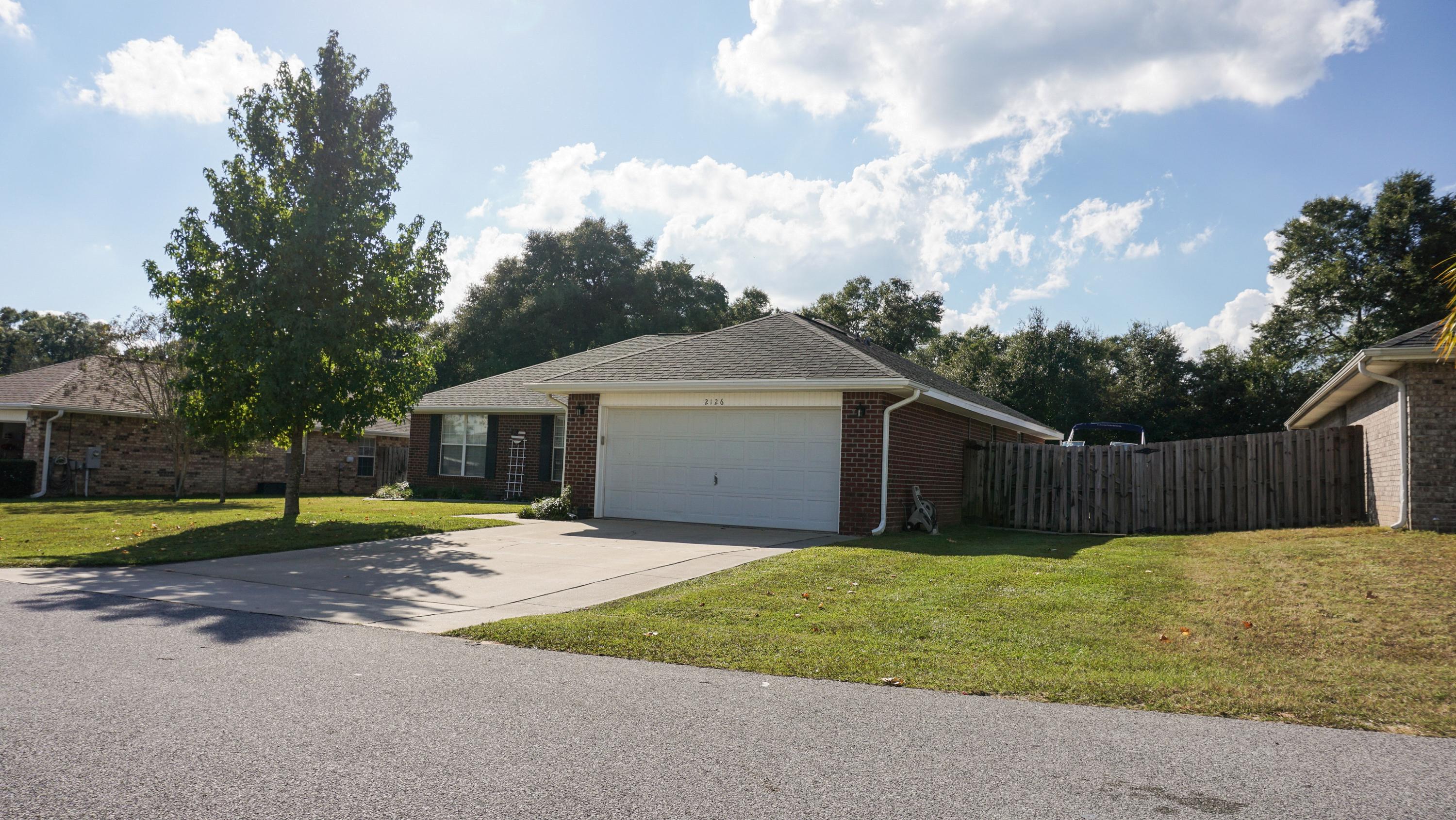 2126 Hagood Loop Crestview, FL 32536 - Photo 2 of 18 a view of a back yard of the house