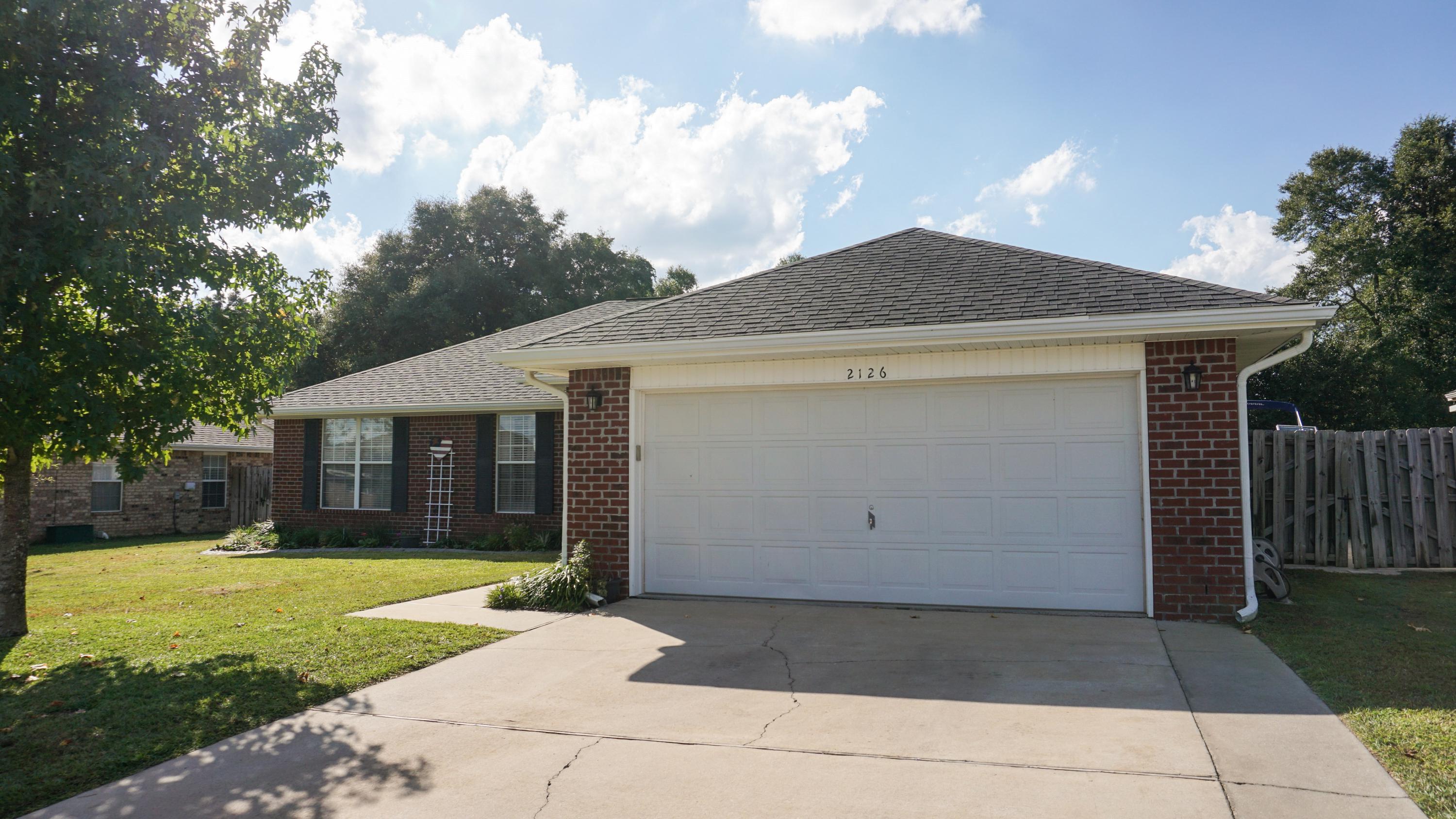 2126 Hagood Loop Crestview, FL 32536 - Photo 3 of 18 a front view of house with yard and green space