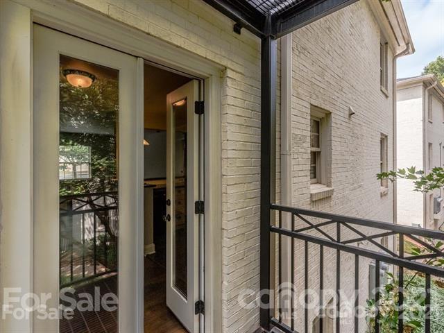 4913 Park Road, Unit D Charlotte, NC 28209 - Photo 15 of 32 a view of a balcony and car parked