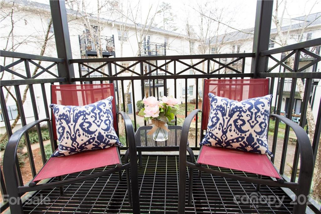 4913 Park Road, Unit D Charlotte, NC 28209 - Photo 17 of 32 a view of a red door and an outdoor space
