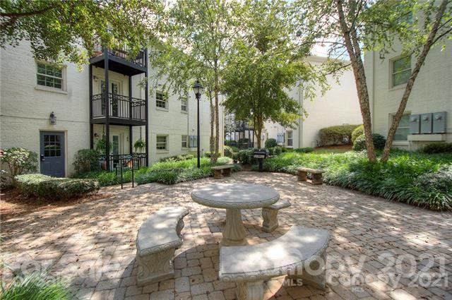 4913 Park Road, Unit D Charlotte, NC 28209 - Photo 20 of 32 a view of a house with a tree in front