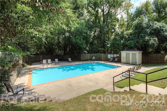 4913 Park Road, Unit D Charlotte, NC 28209 - Photo 21 of 32 a view of a backyard with sitting area and furniture