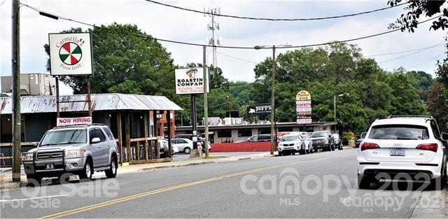 4913 Park Road, Unit D Charlotte, NC 28209 - Photo 26 of 32 a car parked in front of a house