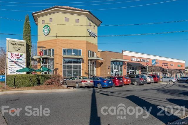 4913 Park Road, Unit D Charlotte, NC 28209 - Photo 29 of 32 a front view of a building with street