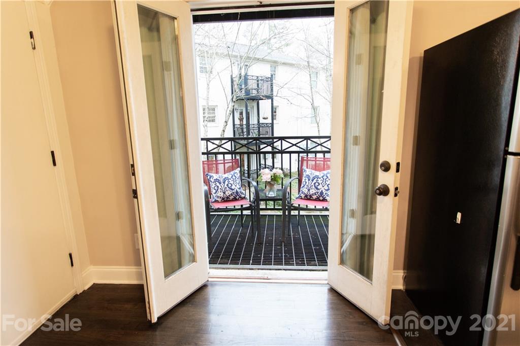 4913 Park Road, Unit D Charlotte, NC 28209 - Photo 7 of 32 a view of front door with wooden floor