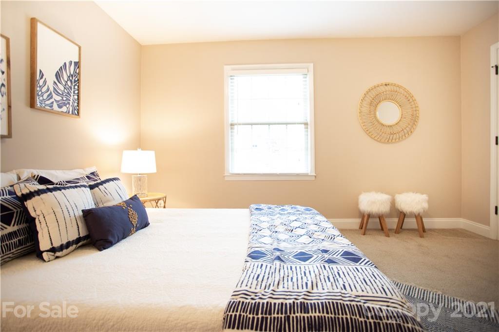 4913 Park Road, Unit D Charlotte, NC 28209 - Photo 9 of 32 a bedroom with bed and a window