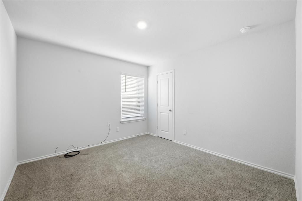 549 Bronze Circle East Springtown, TX 76082 - Photo 16 of 29 an empty room with a empty space and windows