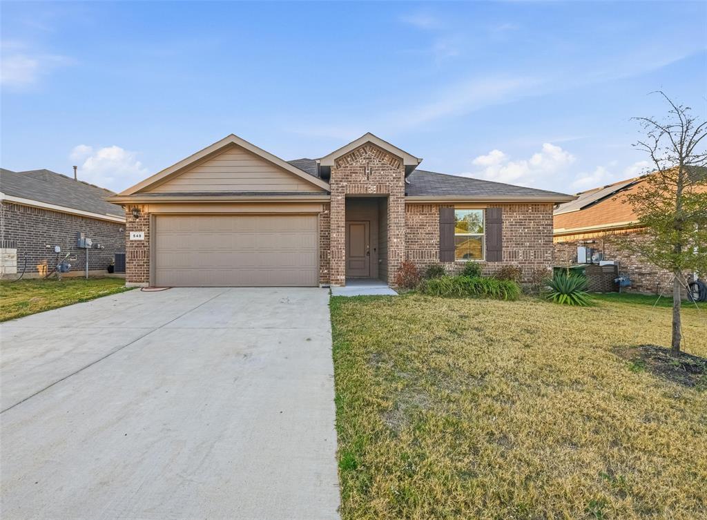 549 Bronze Circle East Springtown, TX 76082 - Photo 2 of 29 a front view of a house with a yard and garage