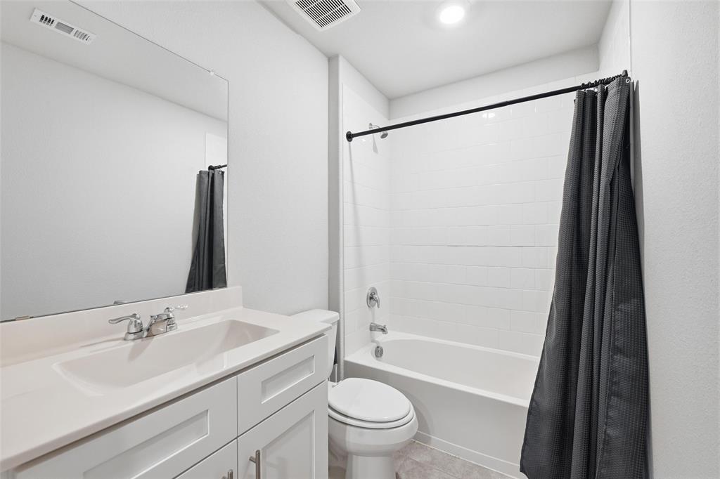 549 Bronze Circle East Springtown, TX 76082 - Photo 22 of 29 a bathroom with a sink toilet and shower