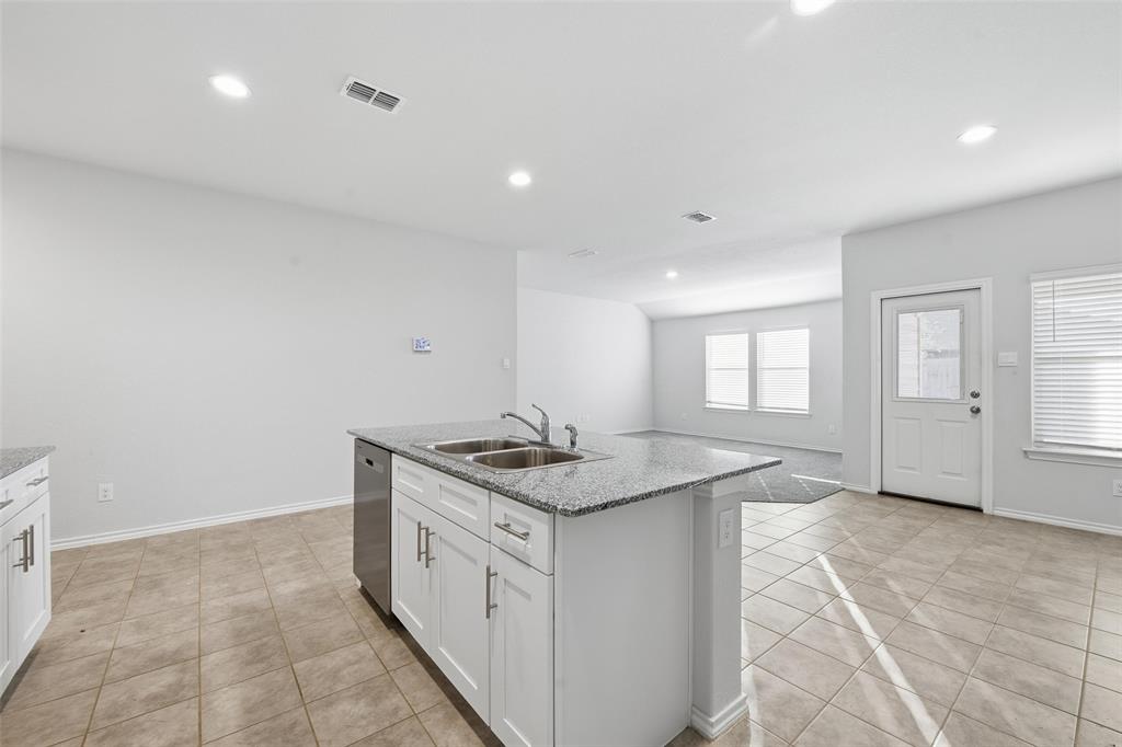 549 Bronze Circle East Springtown, TX 76082 - Photo 6 of 29 a bathroom with a granite countertop sink and a mirror