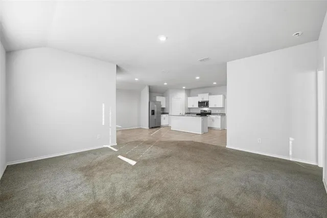 a view of a kitchen with a sink and cabinets
