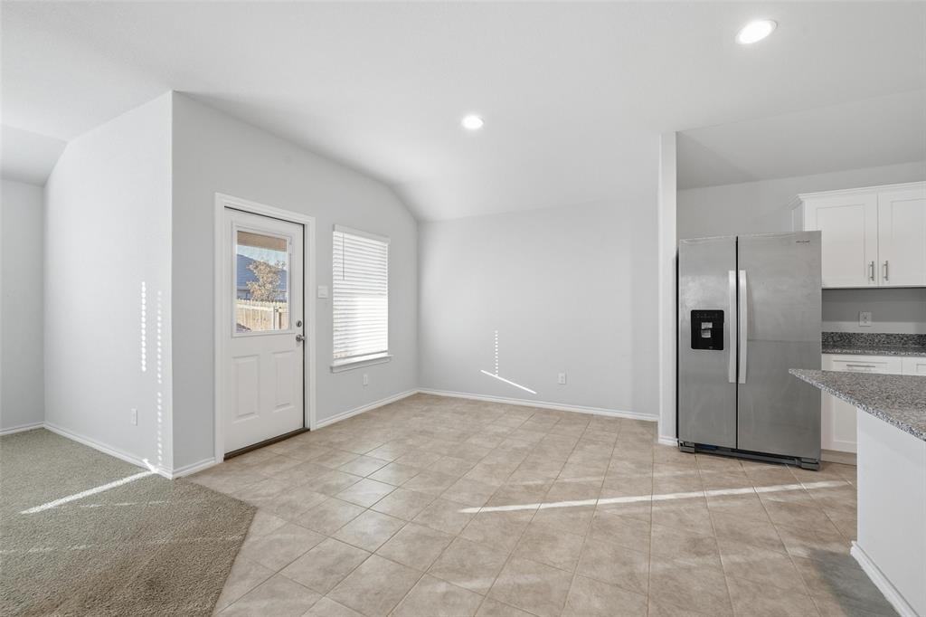 549 Bronze Circle East Springtown, TX 76082 - Photo 8 of 29 a view of a kitchen with a sink and a refrigerator