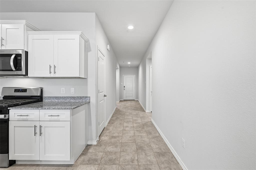 549 Bronze Circle East Springtown, TX 76082 - Photo 9 of 29 a view of a kitchen with electric appliances