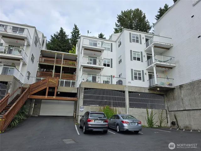 a view of a car park in front of house