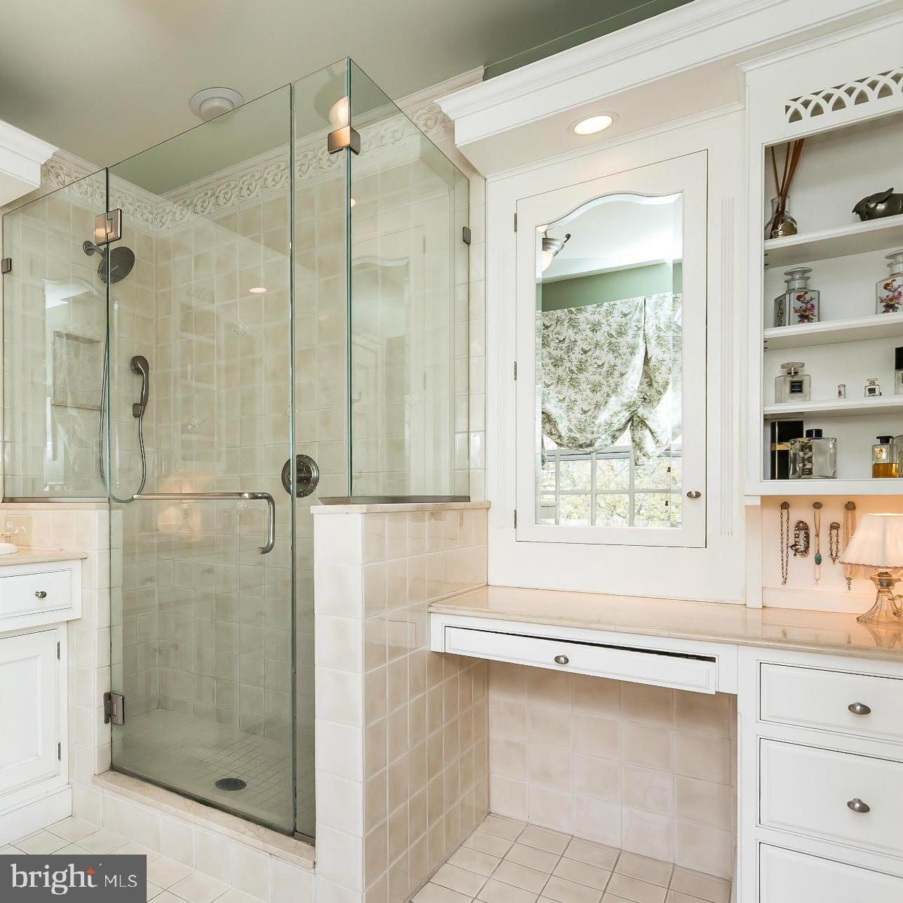 117 Upnor Road Baltimore, MD 21212 - Photo 17 of 32 a bathroom with a shower sink and mirror