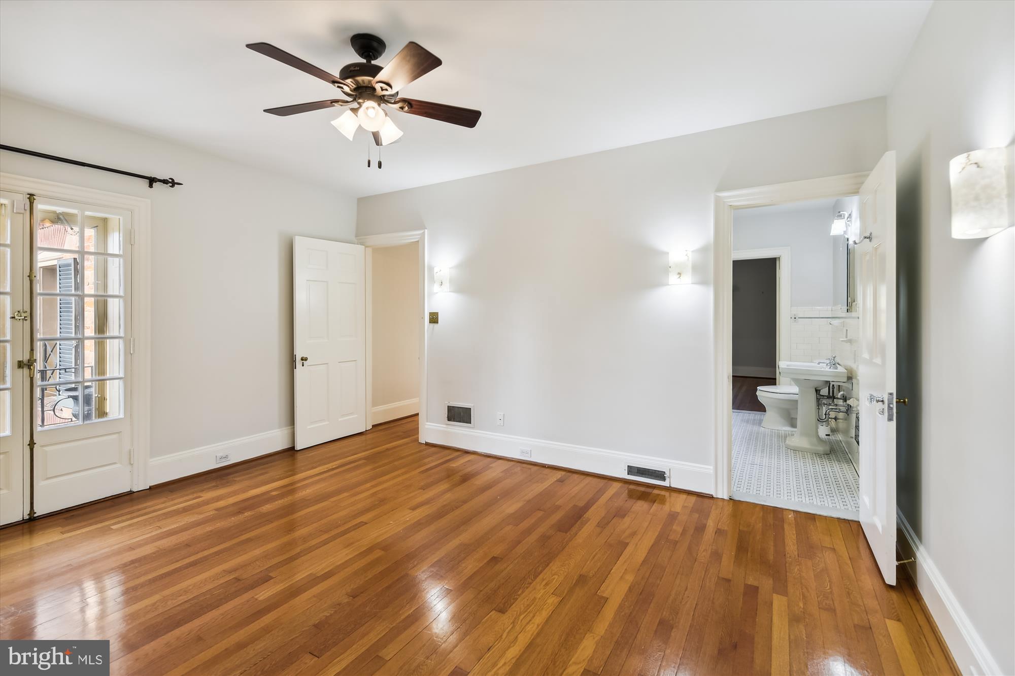 117 Upnor Road Baltimore, MD 21212 - Photo 19 of 32 wooden floor in an empty room with a window