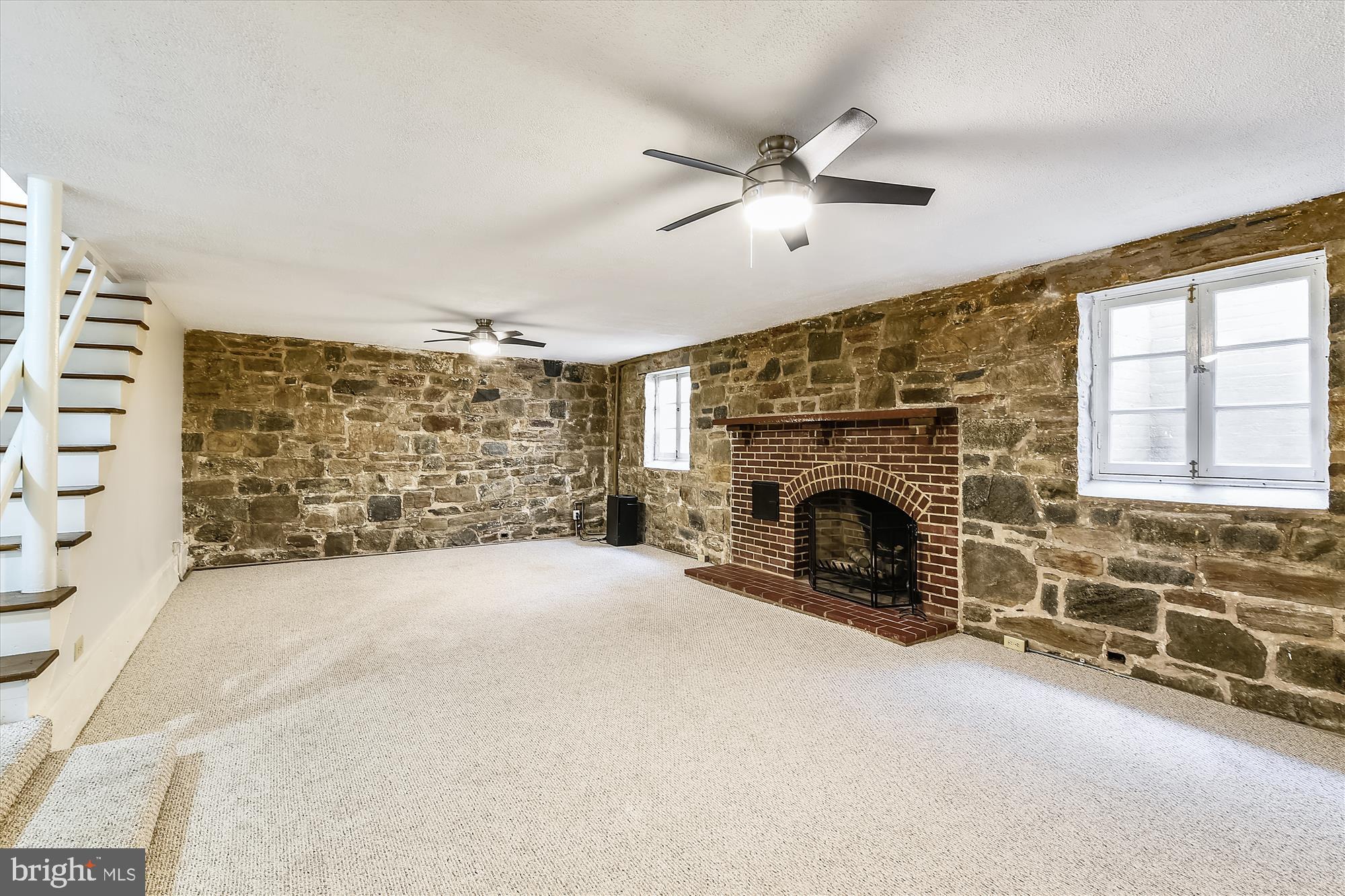 117 Upnor Road Baltimore, MD 21212 - Photo 23 of 32 a view of empty room with fireplace and windows