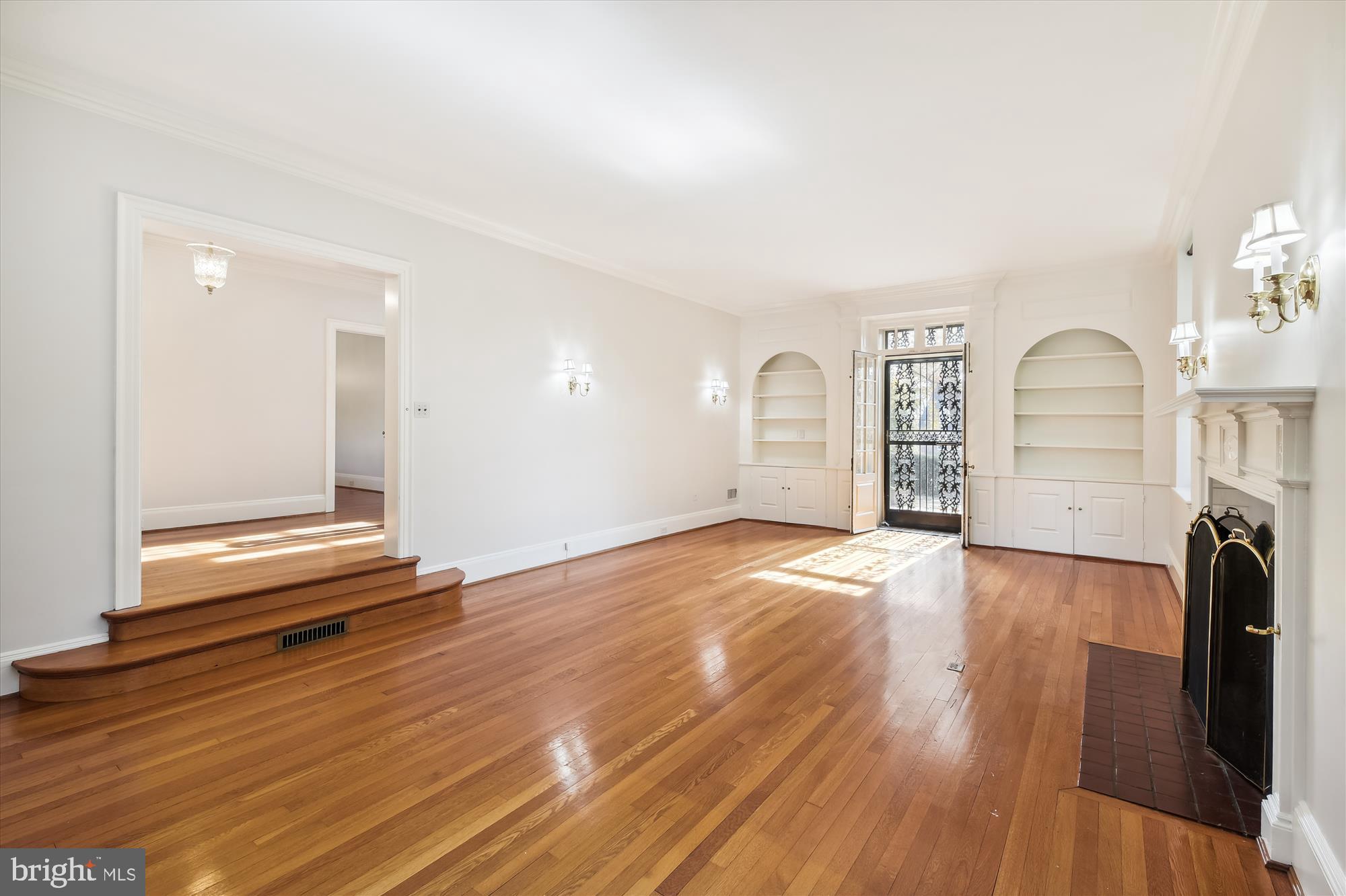 117 Upnor Road Baltimore, MD 21212 - Photo 4 of 32 an empty room with wooden floor and windows