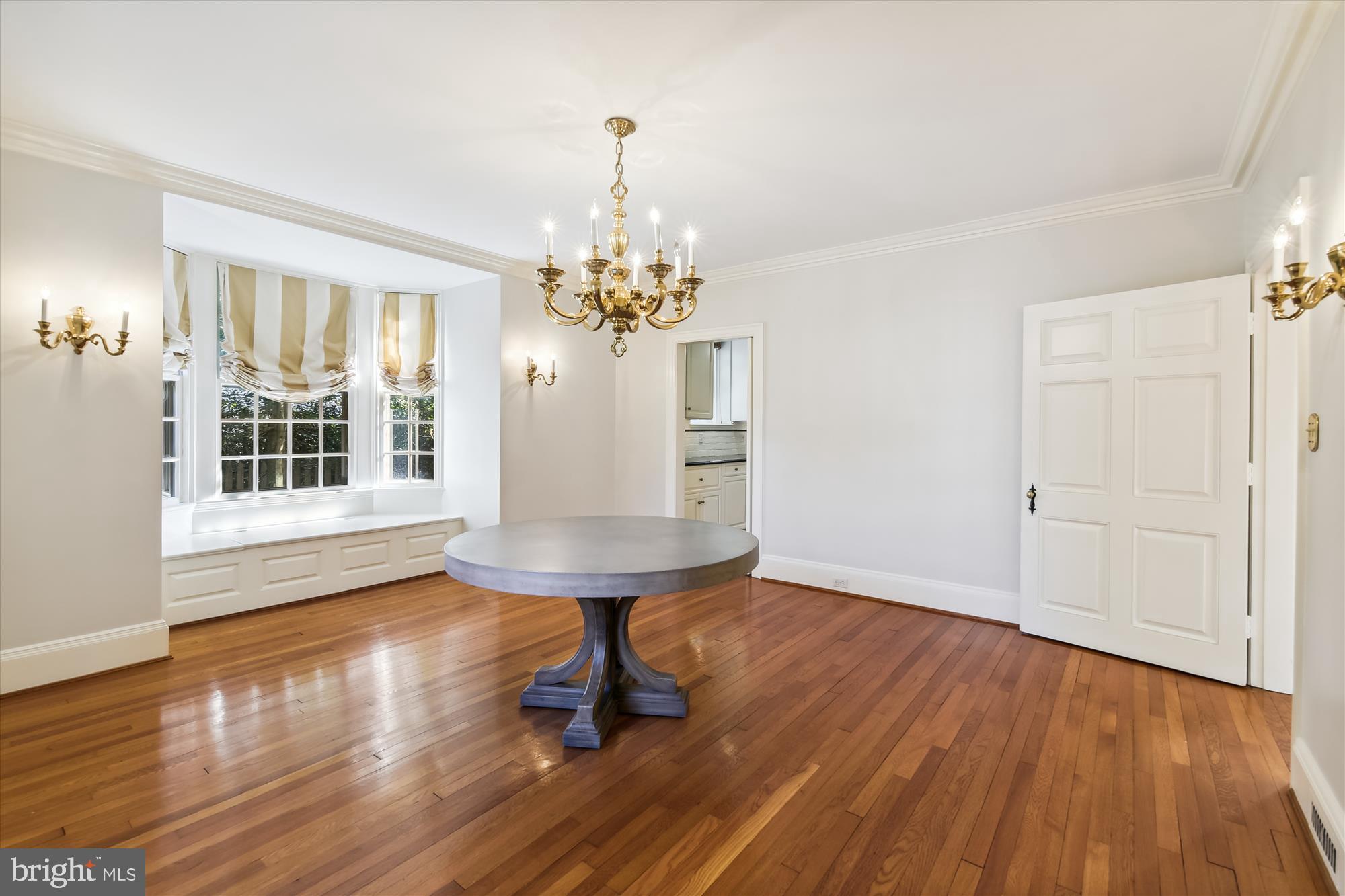 117 Upnor Road Baltimore, MD 21212 - Photo 8 of 32 a view of a livingroom with furniture wooden floor chandelier and windows