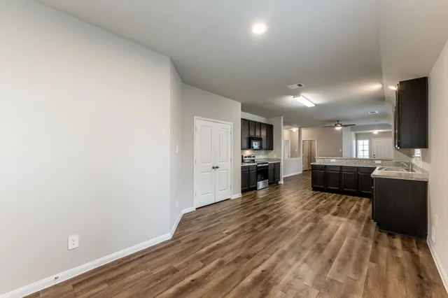 a view of a kitchen with microwave and cabinets