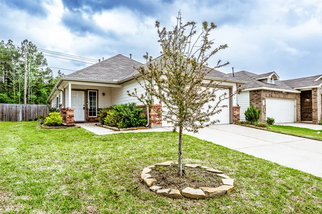 a backyard of a house with lots of green space