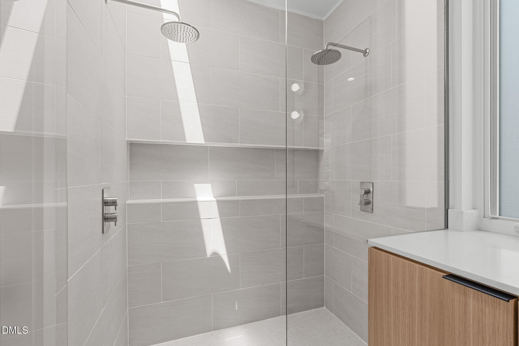501 South Bloodworth Street, Unit 105 Raleigh, NC 27601 - Photo 27 of 59 a bathroom with a shower and a sink