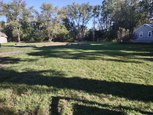 a view of a lake from a yard